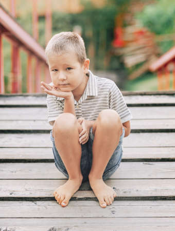 Outdoor portrait of a little cute boy