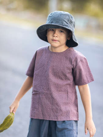 Outdoor portrait of a little cute boyの写真素材