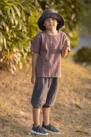 Outdoor portrait of a little cute boyの写真素材