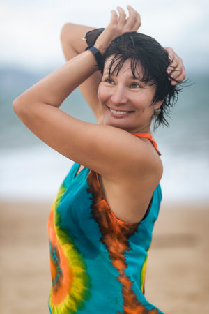 Outdoor portrait of a beautiful smiling woman near the seaの写真素材