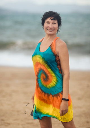 Outdoor portrait of a beautiful smiling woman near the seaの写真素材