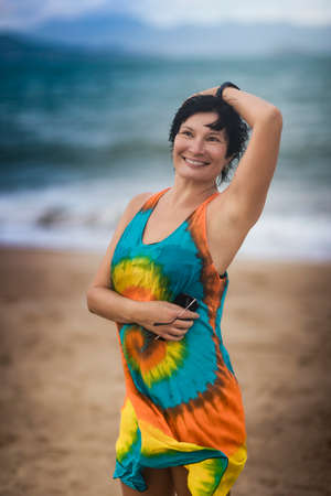 Outdoor portrait of a beautiful smiling woman near the seaの写真素材