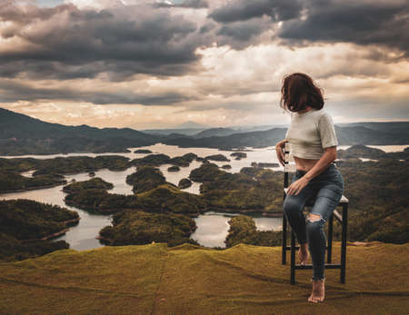 Woman overlooking amazing view of Ta Dung lake. Vietnam. Panorama landscape