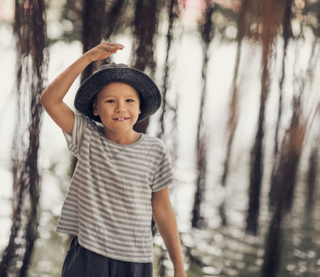 Outdoor portrait of a cute boy smilingの写真素材