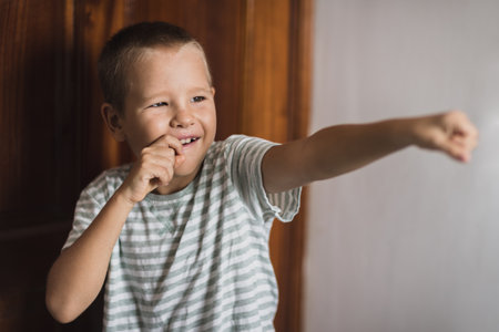 Indoor portrait of a cute boy smilingの写真素材