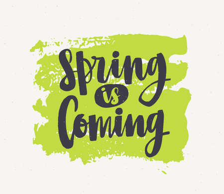 Spring Is Coming lettering written with elegant cursive font or script on green paint smear isolated on white background.のイラスト素材