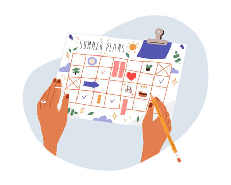 Summer plans concept. Hand writing holiday schedule in paper planner calendar. Organizing, filling...