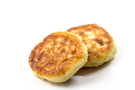 two fresh curd fritters on whiteの写真素材
