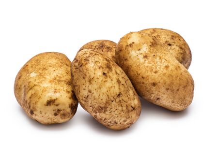pile of washed potatoes isolated on white backgroundの写真素材