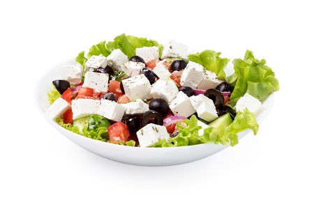 greek salad in plate isolated on white backgroundの写真素材