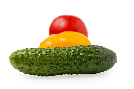cucumber bell pepper and tomato in traffic light order isolatedの写真素材