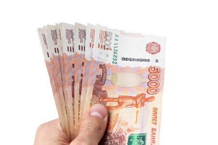 man hand gives rubles isolated on white backgroundの写真素材