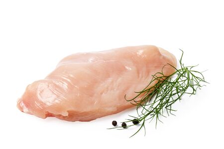 raw chicken fillet with pepper and dill isolated on whiteの写真素材