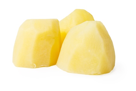 boiled potato pieces isolated on whiteの写真素材