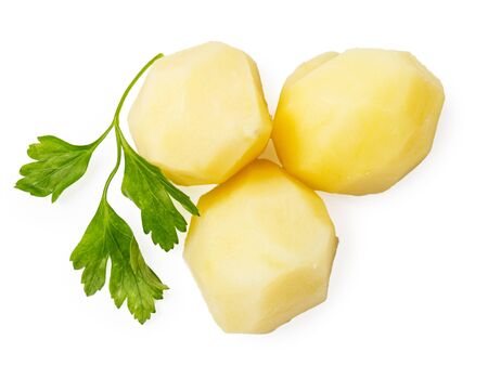 boiled potato pieces with parsley isolated on whiteの写真素材