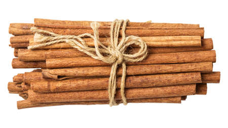 tied sticks of cinnamon top view isolated on whiteの写真素材