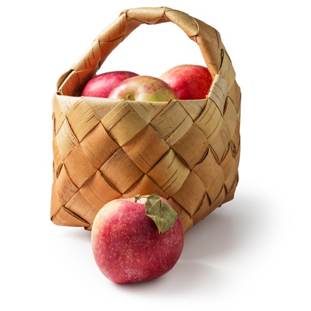 basket of fresh apples isolated on white backgroundの写真素材