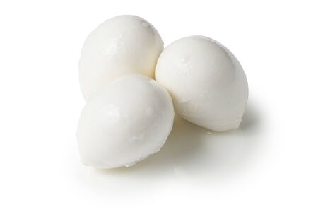 just balls of mozzarella cheese on white backgroundの写真素材