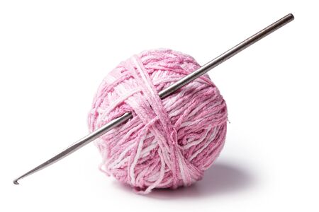 a ball of yarn with crochet isolated on white backgroundの写真素材