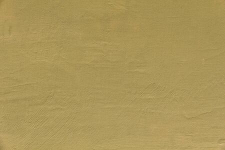yellow painted wall texture with cracksの写真素材