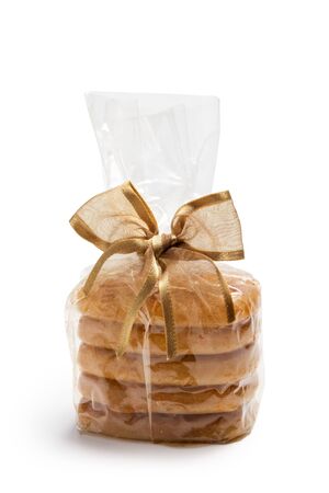 gift aromatic candles in stack with bow isolated on whiteの写真素材