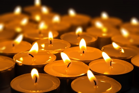 dark composition from burning candles selective focusの写真素材