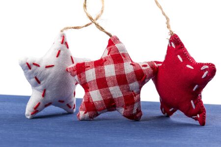 three stars on wooden board isolated on whiteの写真素材