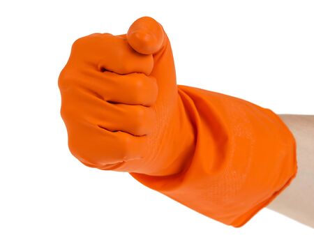 hand in fist outstretched in orange glove isolated on whiteの写真素材