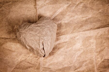 paper heart on crumpled paper, valentine's backgroundの写真素材