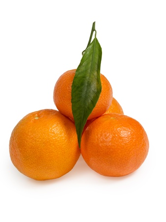 fresh tangerines with leaves isolated on whiteの写真素材
