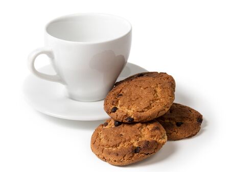 cookies with chocolate pieces and cup isolatedの写真素材