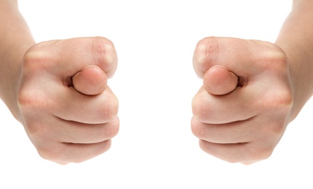 female teen hand show two figs, isolated on whiteの写真素材