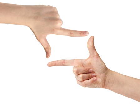 female teen hand showing open frame, isolated on whiteの写真素材