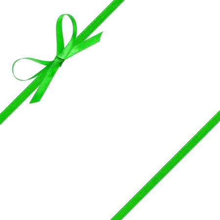 thin green bow with ribbon, isolated on white backgroundの写真素材
