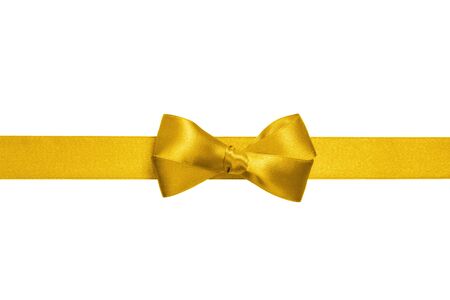 yellow ribbon with simple bow  isolated on white backgroundの写真素材