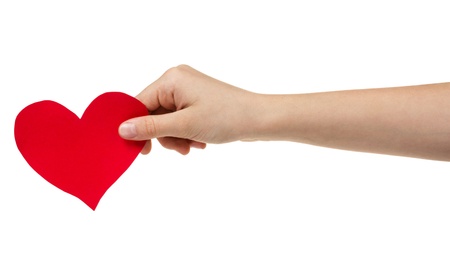 female teen hand holding paper heart, isolated on whiteの写真素材