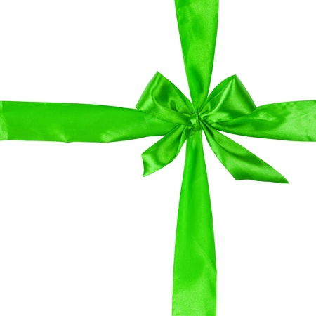 cross from green ribbow with bow, isolated on white backgroundの写真素材