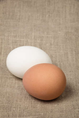 two eggs on burlap, rustic easter backgroundの写真素材