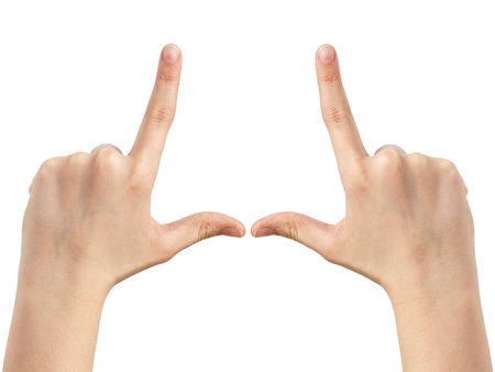 female teen hands show frame, isolated on whiteの写真素材