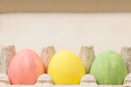 three eggs in container, rustic easter backgroundの写真素材