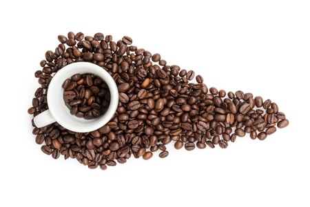 heap of coffee beans with cup, isolated on whiteの写真素材