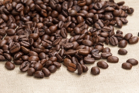 heap of coffee beans on burlap, backgroundの写真素材