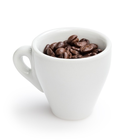 heap of coffee beans in cup, isolated on whiteの写真素材