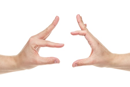 adult man hands compares something, isolated on whiteの写真素材