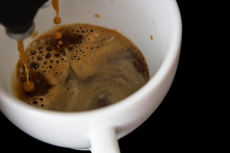 making a cup of coffee, black backgroundの写真素材