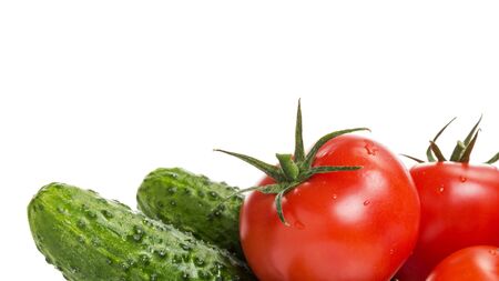 border from tomatoes and cucumbers, isolated on white backgroundの写真素材
