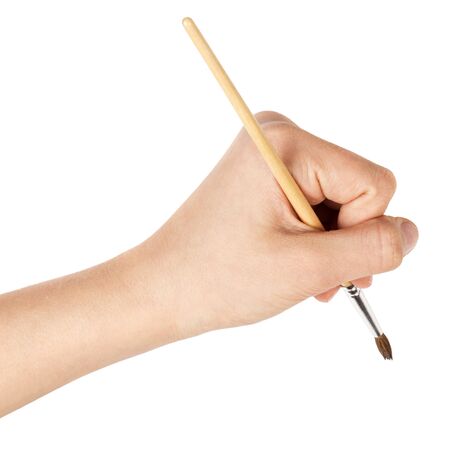 female teen hand with a brush on white backgroundの写真素材