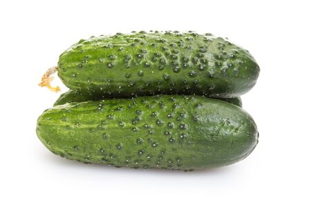 fresh greenhouse cucumbers, isolated on white backgroundの写真素材