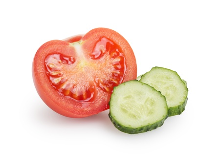 sliced tomato and cucumber, isolated on whiteの写真素材