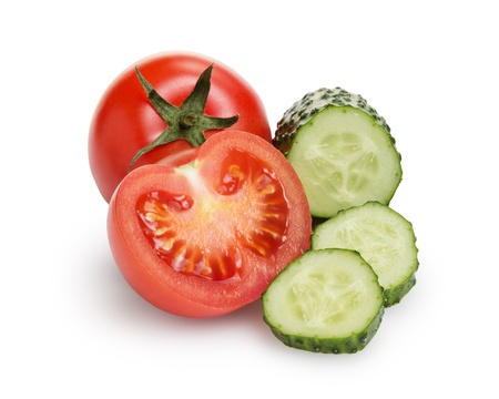sliced tomato and cucumber, isolated on whiteの写真素材